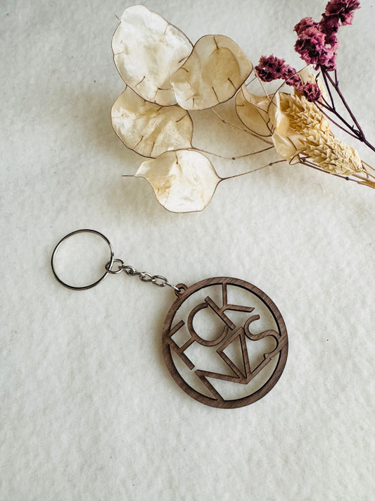 Statement Schlüsselanhänger aus Walnussholz – „FCK NZS“